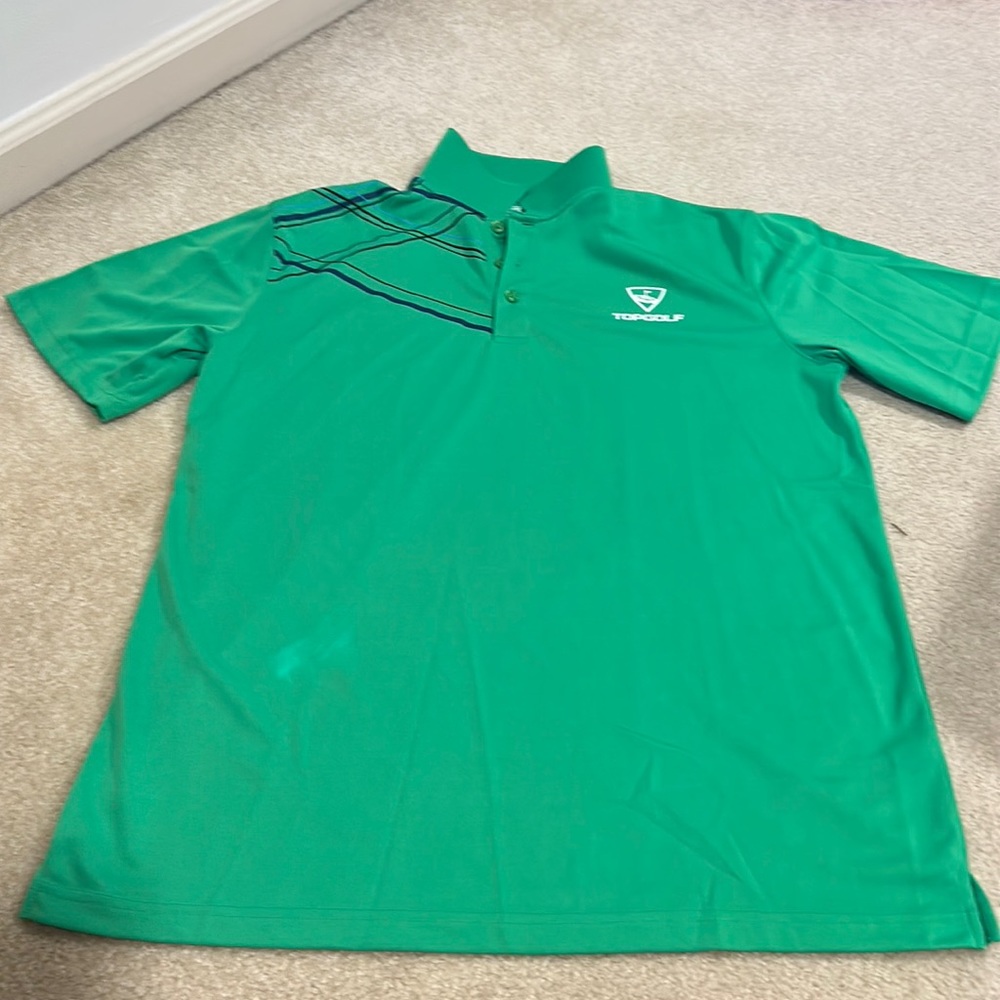 Top Golf polo shirt with side splits. Shirt sleeve. Green. New. Large